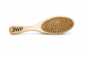 gold color Wooden wave brush close-up with logo