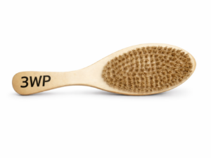 gold color Wooden wave brush close-up with logo